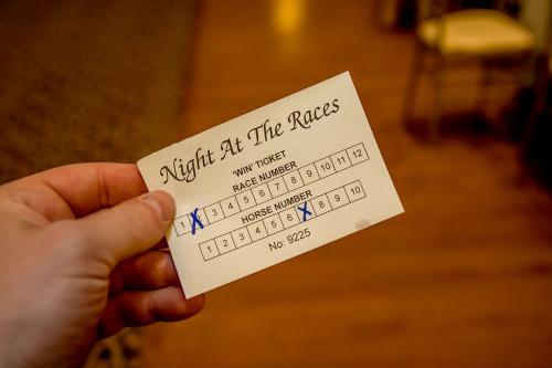 A white slip of paper with the horse betting information