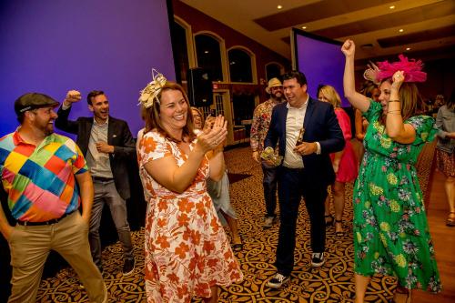 A group of people cheering and clapping