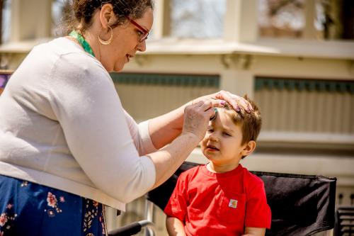 boy having his face painted