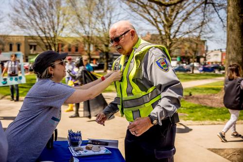 Police Auxiliary receiving a Blue Ribbon Pin