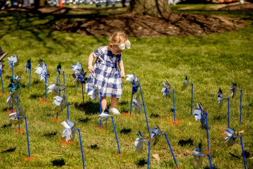 Toddler Planting Pinwheels