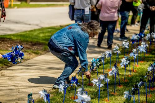 Woman Planting a Pinwheel