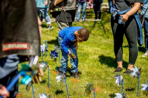 Boy Planting Pinwheels